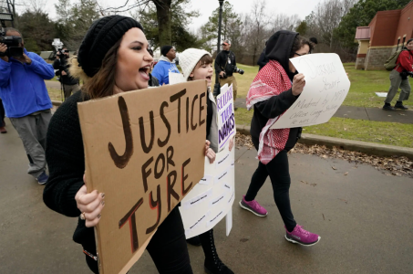A group of demonstrators protest outside a police precinct in response to the death of Tyre Nichols, who died after being beaten by Memphis police officers, in Memphis, Tenn., Sunday, Jan. 29, 2023. photo via Houston Public Media