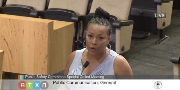 Screengrab from public safety meeting of Cynthia speaking into microphone