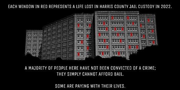 Art piece drawing attention to conditions in Harris County Jail, showing a set of windows with many in red. Text reading, Each window in red represents a life lost in Harris County Jail custody in 2022. A majority of people here have not been convicted of a crime: they simply cannot afford bail. Some are paying with their lives.