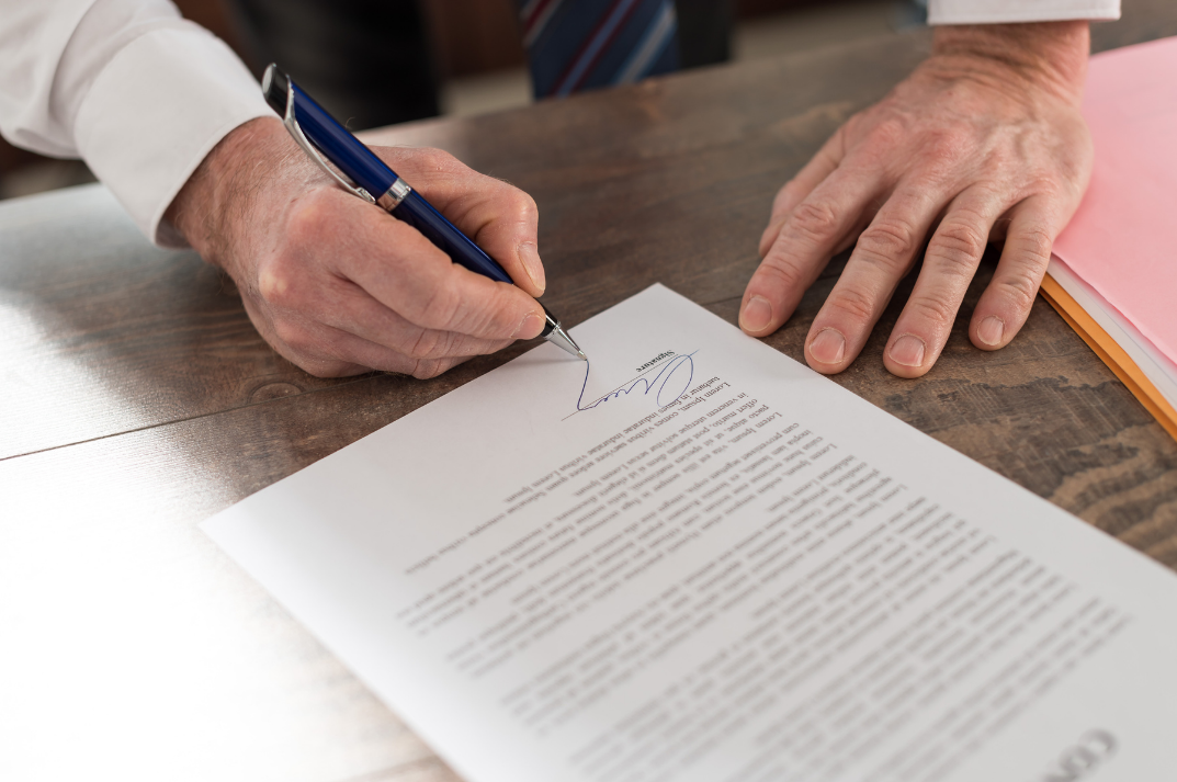 Man signing documents