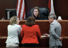 Photo via Houston Chronicle: Judge Amy Martin listens to Andre Jackson's defense attorney Jerome Godinich, right, and prosecutor Tiffany Duprie, left, discuss Jackson's case in the Harris County Criminal Courts, Wednesday, June 19, 2019, in Houston.