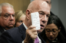 Sen. Whitmire holds up a note. Credit Jon Shapley